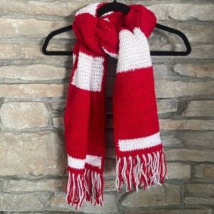 Red and white striped hand knit scarf with fringe.